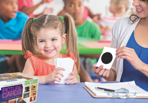 A young child doing the Expressive Labeling — Shapes lesson with ARIS picture cards